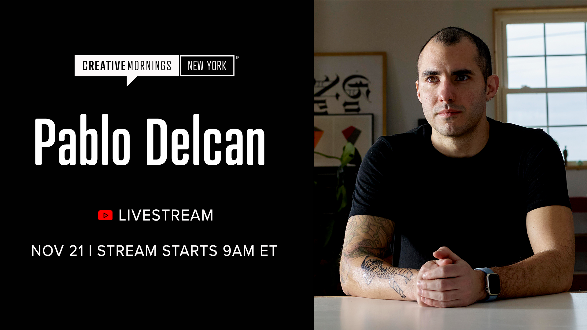 A promotional graphic featuring large white text on a black background that reads &ldquo;Pablo Delcan.&rdquo; Below it are a red YouTube icon and the word &ldquo;Livestream,&rdquo; followed by &ldquo;Nov 21 | Stream starts 9AM ET.&rdquo; On the right side of the image, a person with short hair and a black T-shirt sits at a table with hands clasped, showing a tattooed arm and a smartwatch. Framed artwork and a window appear in the softly lit background.