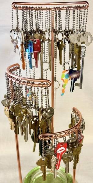 Title: “Keypers” Using a life time of saved keys, which I no longer have what they unlocked, these represent memories of possessions that were at one time precious enough to be locked.  