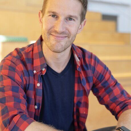 Andrew whelan plaid headshot profile photo