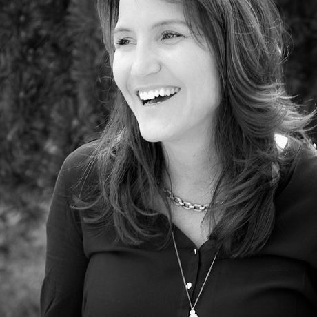 Pattieheadshotblkwhitelaugh