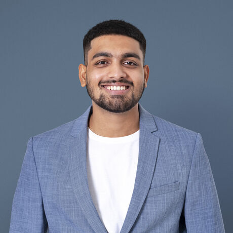 Cheerful indian businessman smiling closeup portrait jobs career campaign