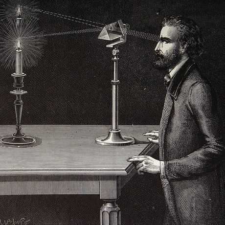 A. the refraction of candlelight through a prism.
