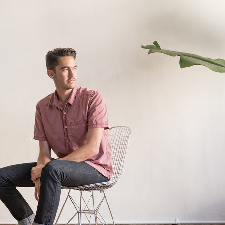 1 kort sitting on wire chair copy