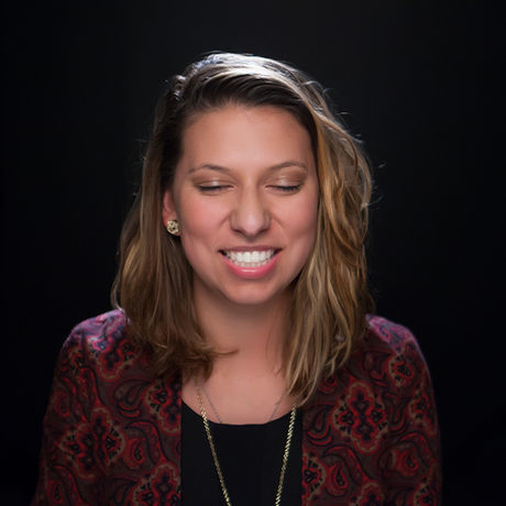 Danielle dark headshot smiling reduced