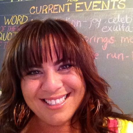 Ali.chalkboard.headshot