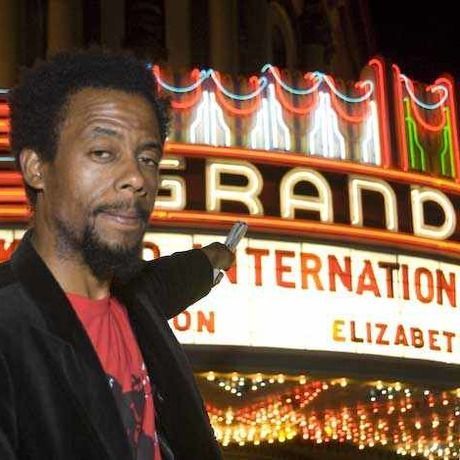 Droach pointing to theater