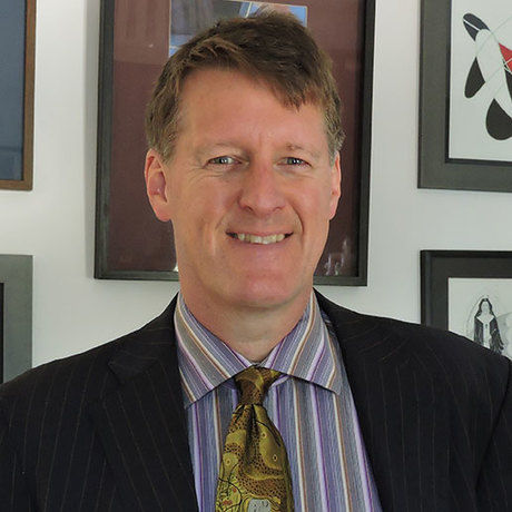 John in suit square profile