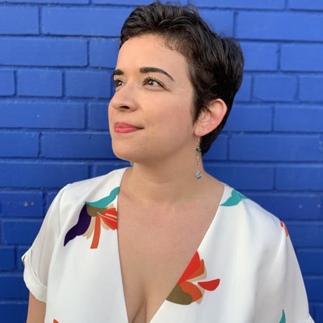 Headshot blue wall