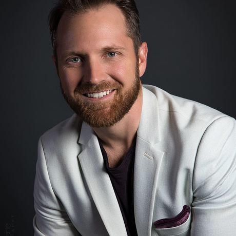 Jason white coat headshot