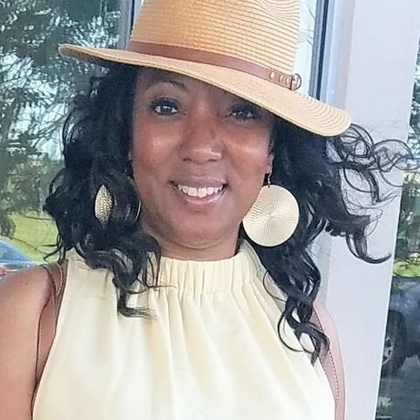 Sharon in yellow dress and hat