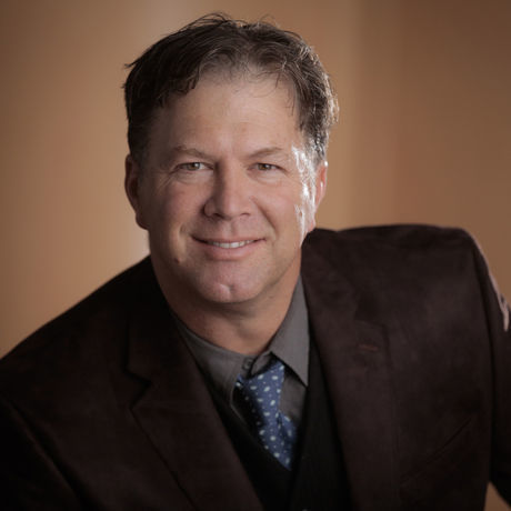 Jeremiah headshot brown coat