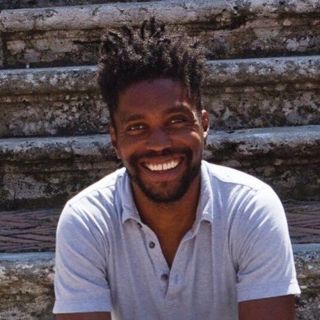 Qaid smiling on steps 1