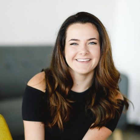 Ashley yellow chair headshot  3 