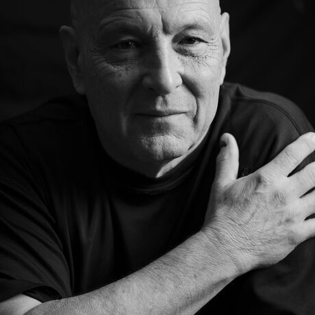 Hands crossed  straight look