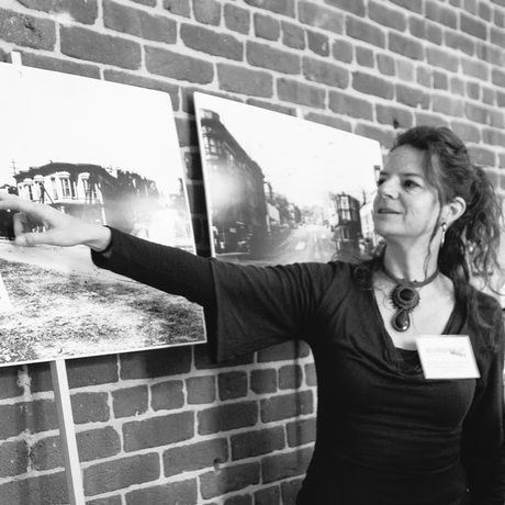 Lr pointing out historical photo at ssf history expo booth 2015 square steph theune