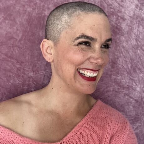 Janelle headshot 2025 selfy pink sideways web