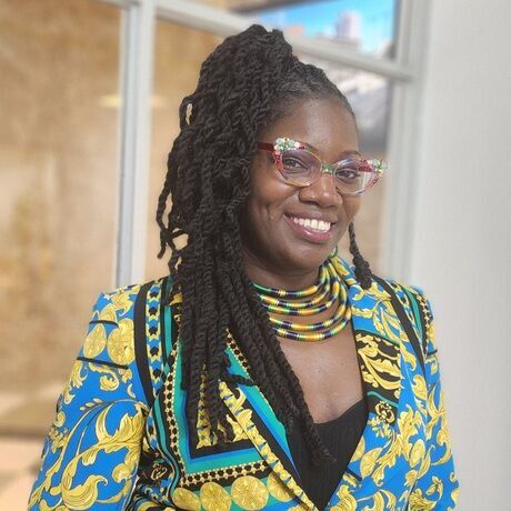 Tya s headshot   blue jacket