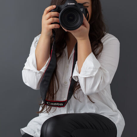 Photographer holding camera portrait