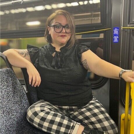 Nicole on a bus intro photo