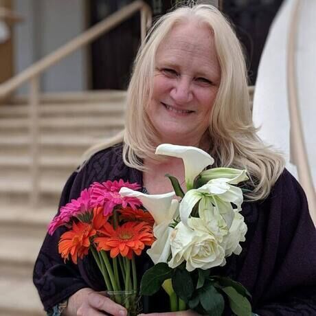 Marcia headshot with flowers