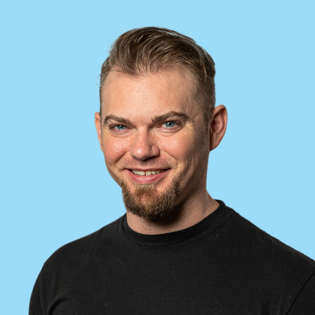 Nate s headshot   blue background   snax media