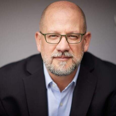 George staring into camera