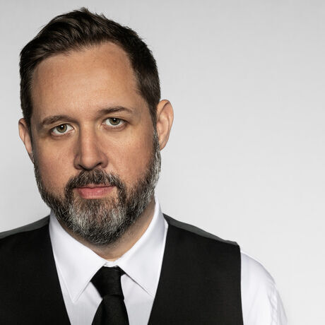 Dagan headshot color on white by 161 photography